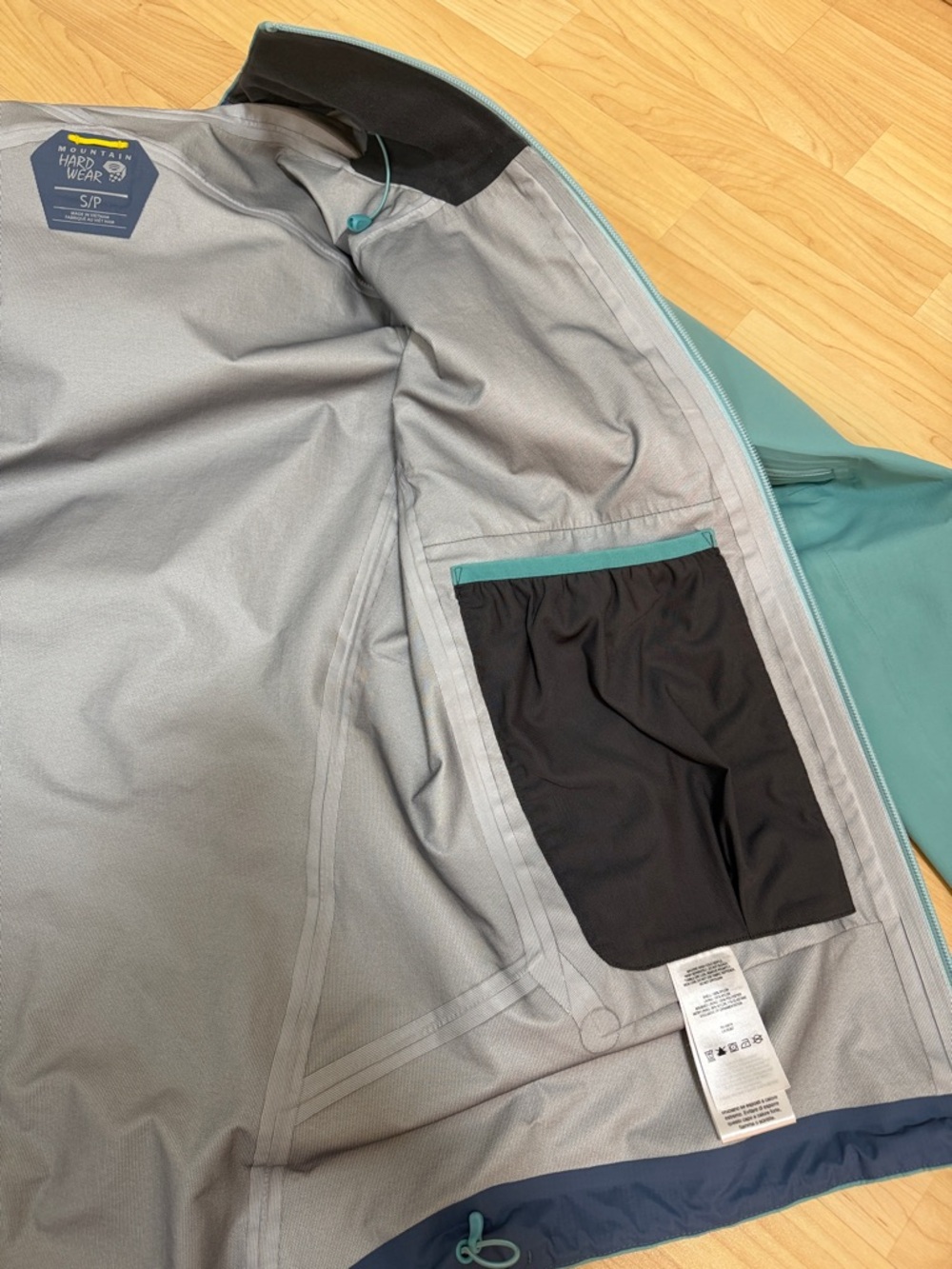 Mountain Hardwear Light Blue Hooded Shell Jacket with Yellow Zips - Picture 5 of 11